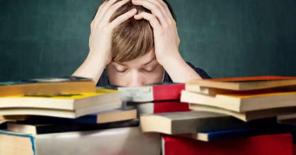 “Education debt crisis in America economy problems with student and piles of loan documents in classroom”