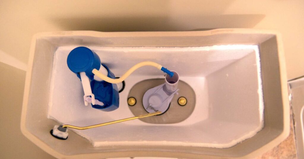 A realistic overhead shot of an open toilet tank with vinegar being poured inside as part of a maintenance cleaning process. The scene is set in a clean, modern bathroom, representing hygiene and home care with a natural, eco-friendly cleaning concept in high detail.