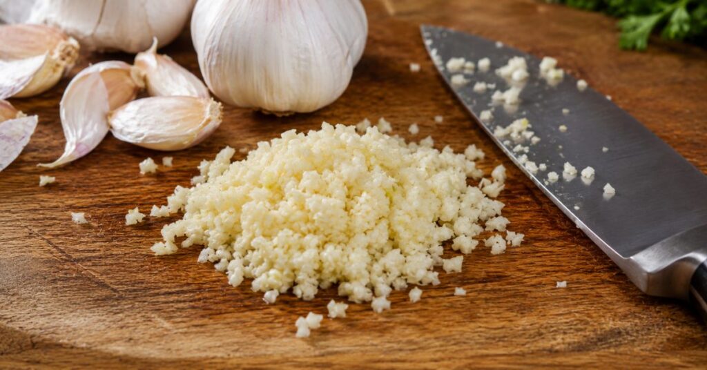 Fresh minced garlic prepared for homemade garlic butter.
